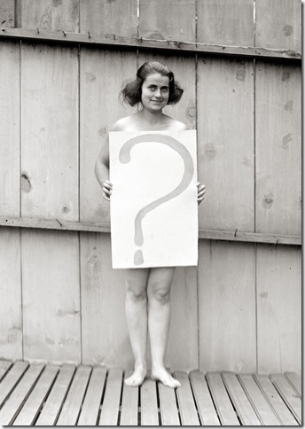 Unclothed_woman_behind_question_mark_sign